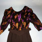 Vintage 1980s cocktail dress with purple and gold iridescent feathers